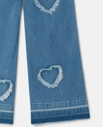 Stretch-Jeans mit Fransen-Herz-Aufnäher
