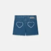 Stretch-Jeansshorts mit Fransen-Herz-Aufnäher